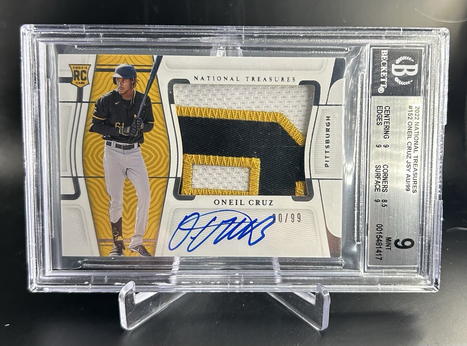 2022 Panini National Treasures - Oneil Cruz (RC) Rookie Patch Auto /99. BGS 9